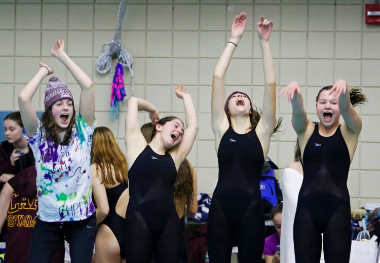 Cape Elizabeth teammates Olivia Tighe, Maddie McCormick, Corinne Wight and Hope Campbell burn off some excitement early in the Maine HIgh School Girls Class B State Swimming and Diving Championships at Bowdoin College on Monday, February 19, 2018. Staff photo by Jill Brady