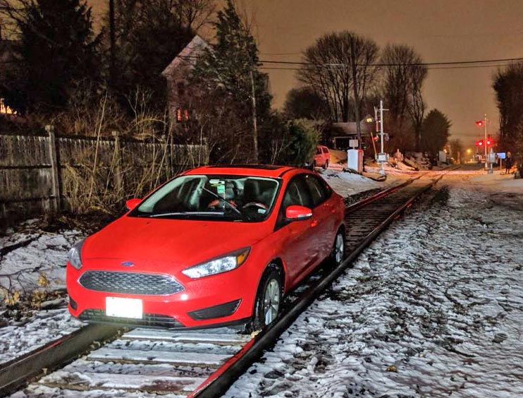 The car got stuck on the tracks between Lincoln and Coyle streets.