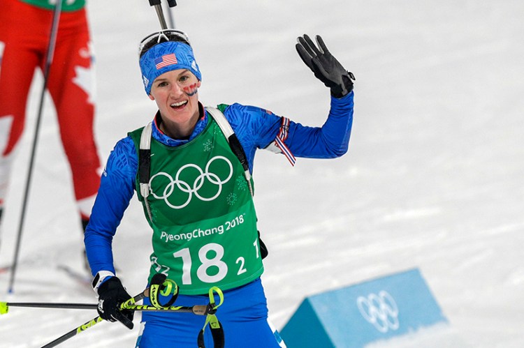 Clare Egan waves to cheering fans after her race during the women's 4x6-kilometer biathlon relay on Thursday.