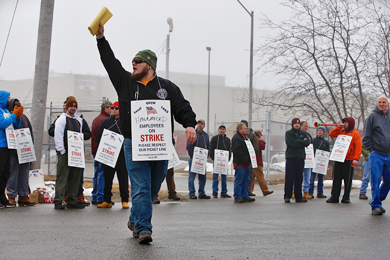 Mathew Farrell, an 18-year employee and shop steward, pickets outside the Hannaford distribution center in South Portland during a one-day strike on Feb. 21.