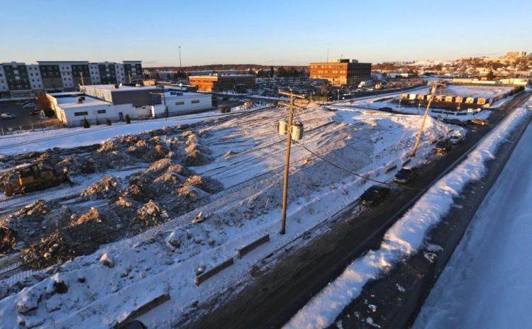 The developer of a proposed housing and retail complex for these empty lots on Somerset Street has requested a permit to build an eight story parking garage at the eastern end of the property.