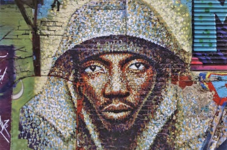 A mural titled "Subway Rider," by artist James Cochran. 