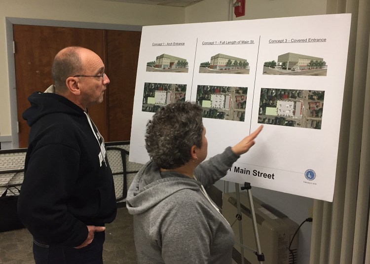 Aspen Avenue residents Phil and Gloria Carter review drawings in February for an affordable housing  building that the South Portland Housing Authority wants to build on Main St.