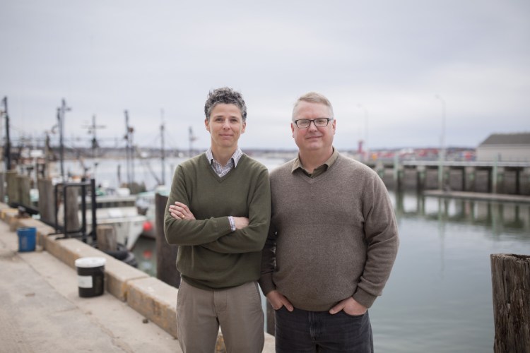 Julie Rosenbach, South Portland's sustainability director, and Troy Moon, Portland's sustainability coordinator, on Portland's waterfront. Both are involved in efforts to make the cities more resilient as the climate changes.
