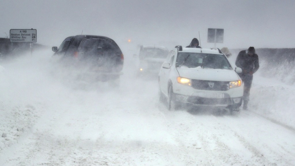White-out conditions bring cars to a stop on a frigid section of highway near Blyth, north east England, on Thursday.