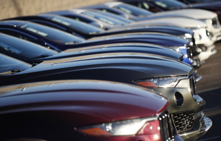 February auto sales fell from a year ago as automakers eased up on cash discounts and other incentives.