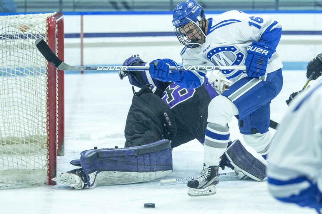 Colby College's Kienen Scott (16) tries to score on Amherst College goalie Connor Girard (29) last month at Colby College in Waterville.