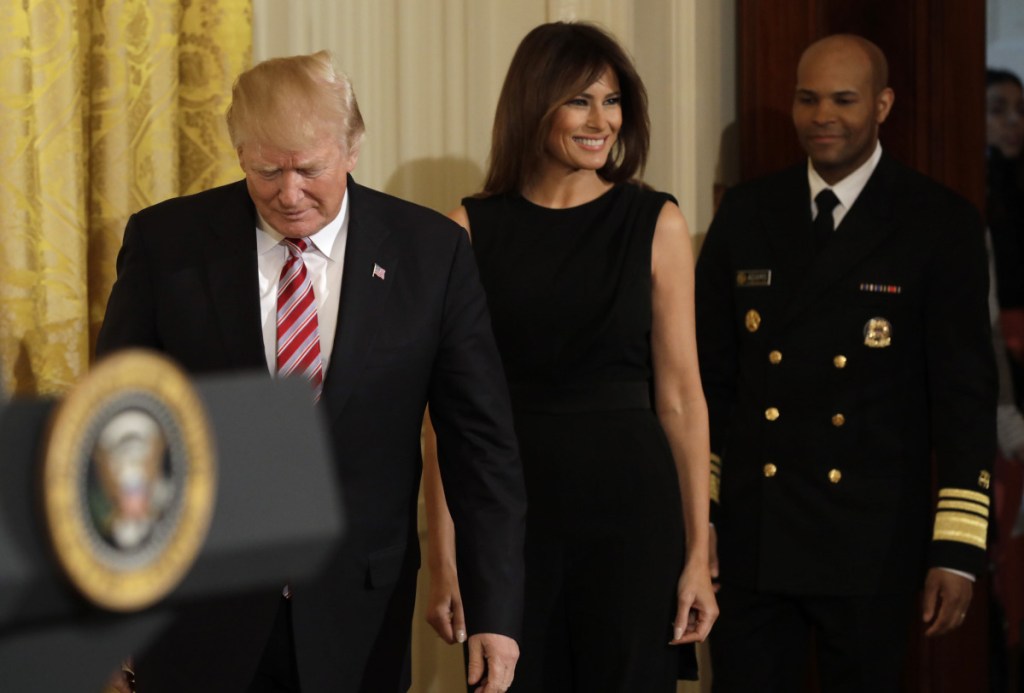 President Trump, First Lady Melania Trump and Vice Adm. Jerome Adams, the U.S. Surgeon General, arrive for a National African American History Month reception in Washington last month. Melania Trump received a green card in 2001.
Left, Melania Trump's parents, Amalija Knavs and Viktor Knavs arrive with the Trumps at the White House last year.