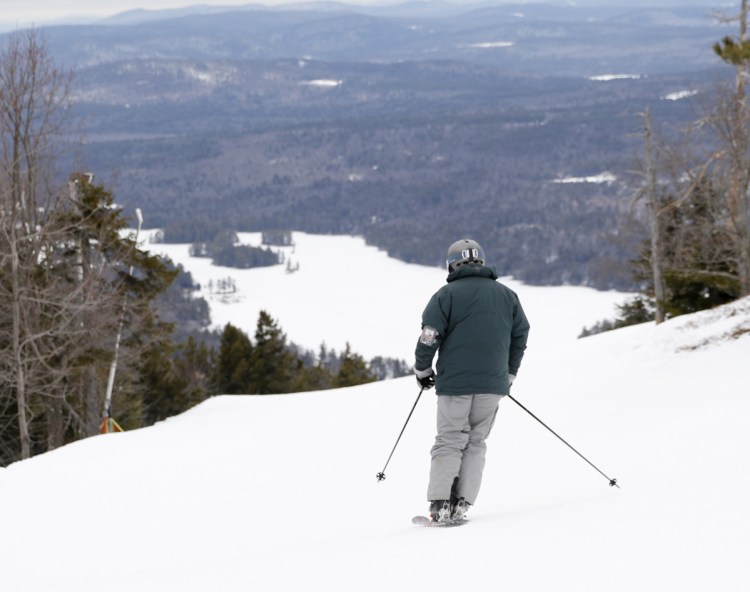 A skier takes a run at Shawnee Peak in Bridgton in January 2017. The ski area on the side of Pleasant Mountain is celebrating its 80th anniversary this season.