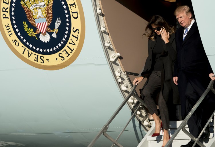 President Trump and first lady Melania Trump arrive at Andrews Air Force Base, Md., on Saturday to board Marine One for a short trip to the White House after visiting Mar-a-Lago.