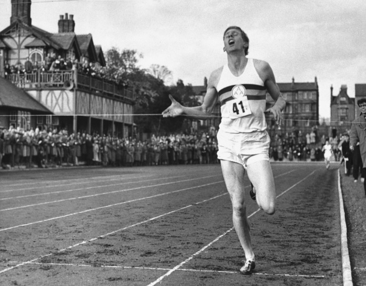 British athlete Roger Bannister breaks the tape to become the first man ever to break the 4-minute barrier in the mile at Iffly Field in Oxford, England, on May 6, 1954.