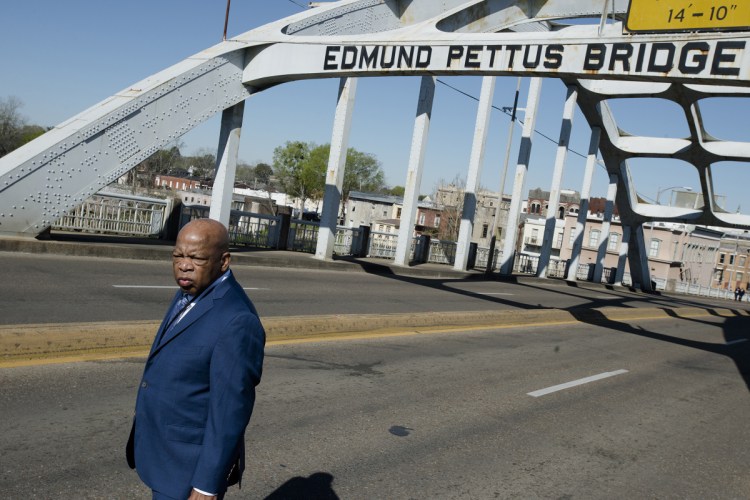Rep. John Lewis stands on the Edmund Pettus Bridge on Sunday in Selma, Ala., during the annual commemoration of "Bloody Sunday," the day in 1965 when voting rights protesters were attacked by police as they attempted to cross the bridge.