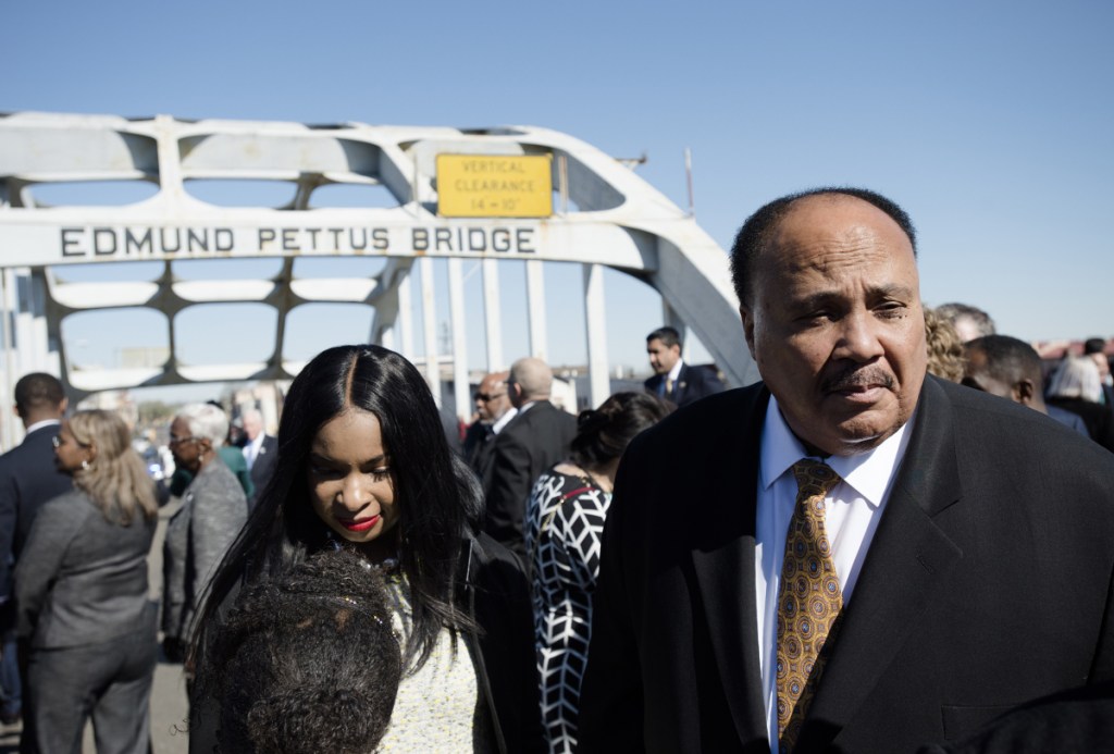 Martin Luther King III stands on the Edmund Pettus Bridge on Sunday in Selma, Ala.