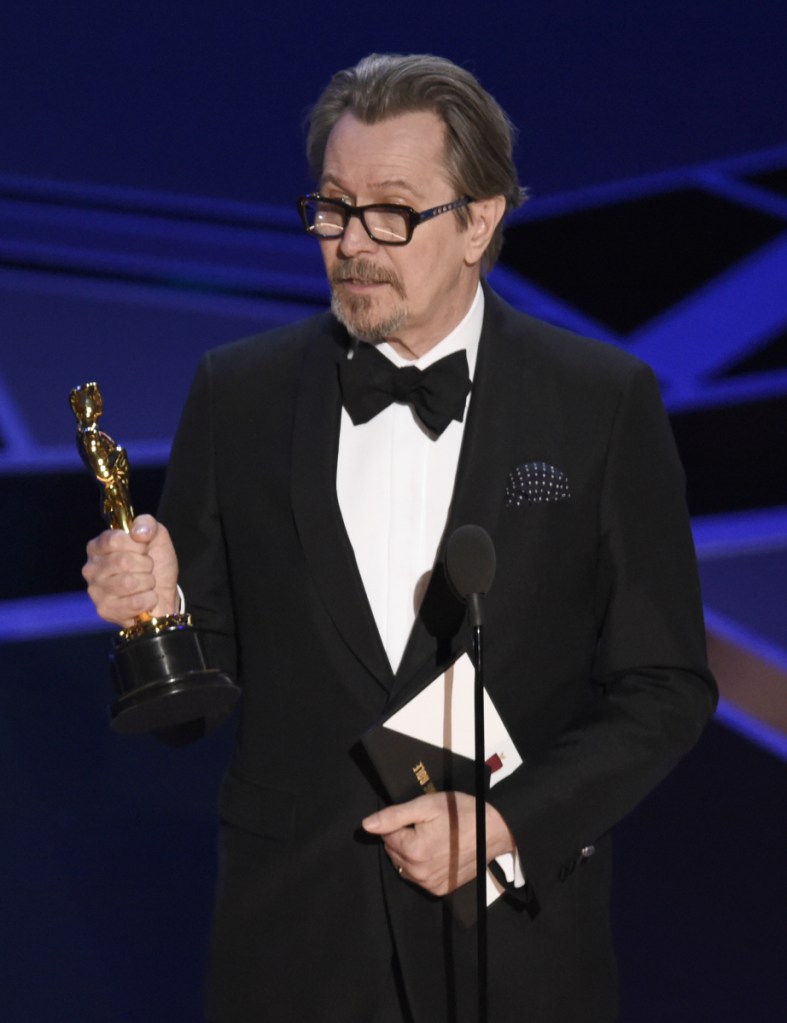 Gary Oldman accepts the award for best performance by an actor in a leading role for "Darkest Hour" at the Oscars on Sunday, March 4, 2018, at the Dolby Theatre in Los Angeles. (Photo by Chris Pizzello/Invision/AP)