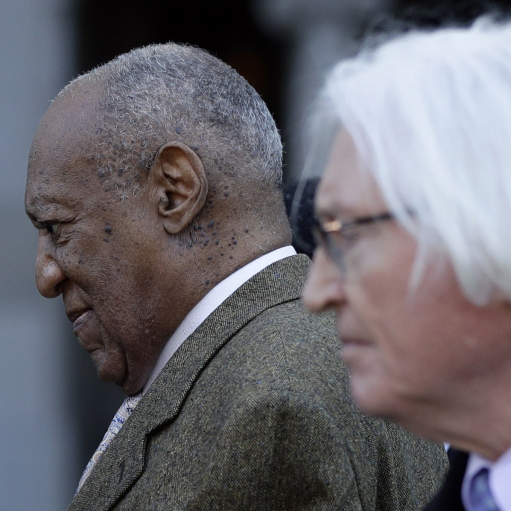 Bill Cosby, left, and attorney Tom Mesereau leave a pretrial hearing at the Montgomery County Courthouse Monday in Norristown, Pa.