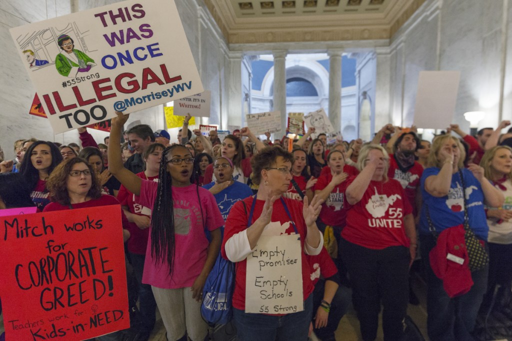 Thousands of teachers and school personnel demonstrate at the capitol in Charleston, W.Va., on Monday, the eighth school day of the statewide teachers' strike.