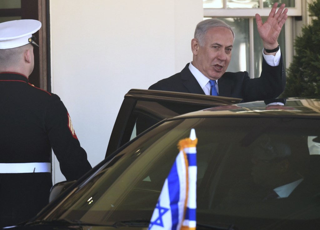 Israeli Prime Minister Benjamin Netanyahu waves as he leaves the White House in Washington on Monday following his meeting with President Trump.