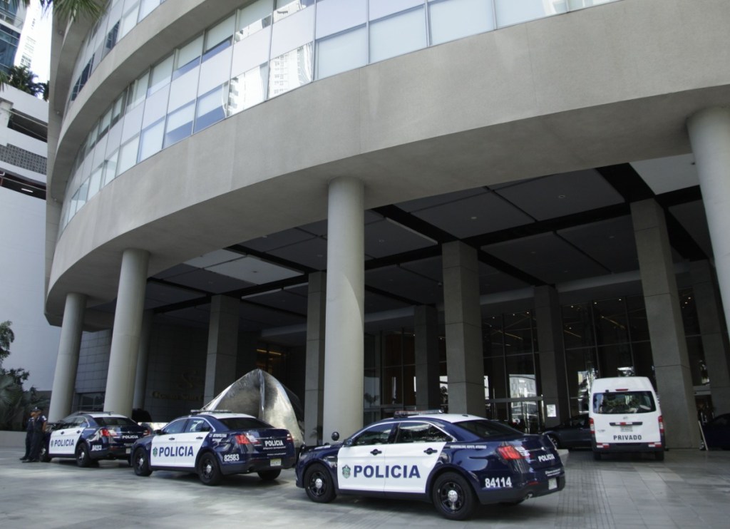 Police cars are parked outside the Trump Ocean Club International Hotel and Tower in Panama City on Monday, when a team of Trump security officials left the property after the court ruled to remove the president's company.