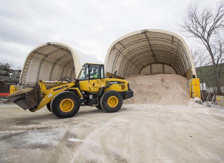 PORTLAND, ME - MARCH 6: Colby Waterhouse uses a loader to a fill truck with a mixture of sand and salt as city workers prepare for a winter storm expected to bring over a foot of snow to the Portland area. (Staff photos by Derek Davis/Staff Photographer)