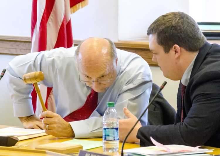 Sen. Dana Dow, R-Waldoboro, left, and Rep. Ryan Tipping, D-Orono, co-chairs of the Taxation Committee, confer before Tuesday's work session on L.D. 1781.