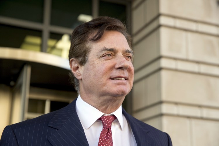 Paul Manafort, President Trump's former campaign chairman, leaves Federal District Court, in Washington in November. Manafort is scheduled for arraignment on Friday in a northern Virginia courthouse on charges including tax evasion and bank fraud.