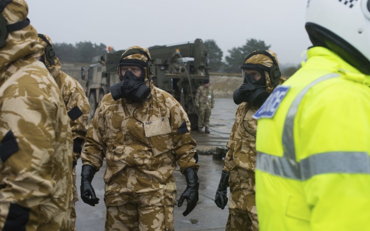 Members of the British military arrive in Salisbury, England, on Friday to help investigate the nerve-agent poisoning of a former Russian spy.