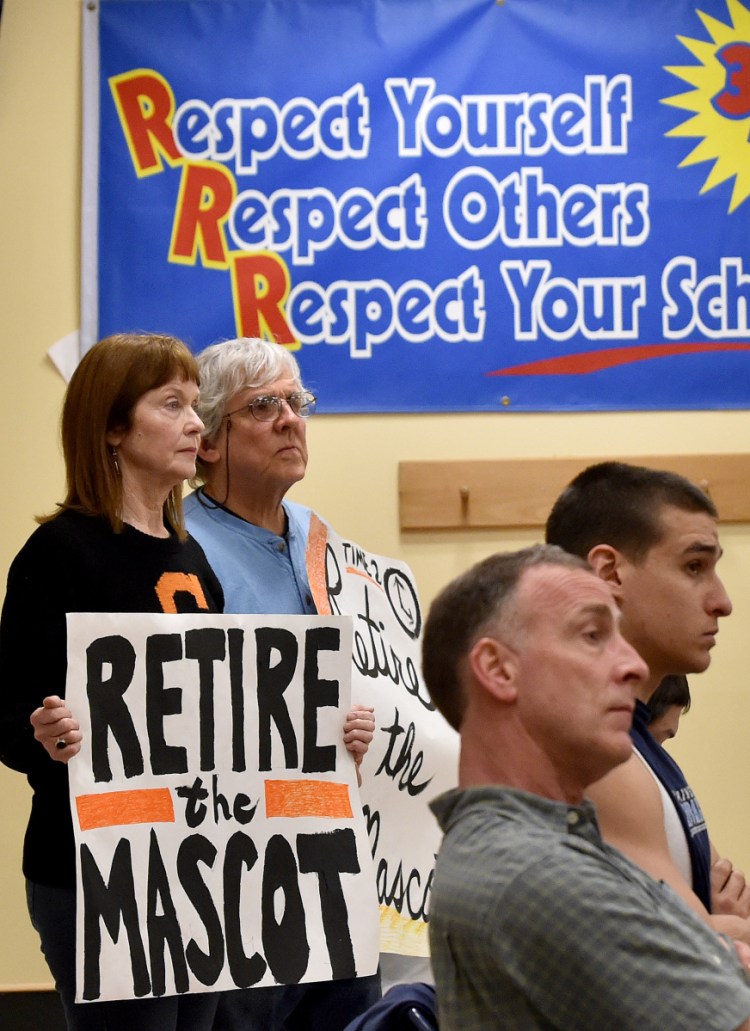 Lisa Savage and Mark Roman advocate the retirement of Skowhegan Area High School's Indian mascot at a 2016 school board meeting. People who defend such mascots aren't uniquely mean-spirited – just ignorant of the bigotry inherent in them.