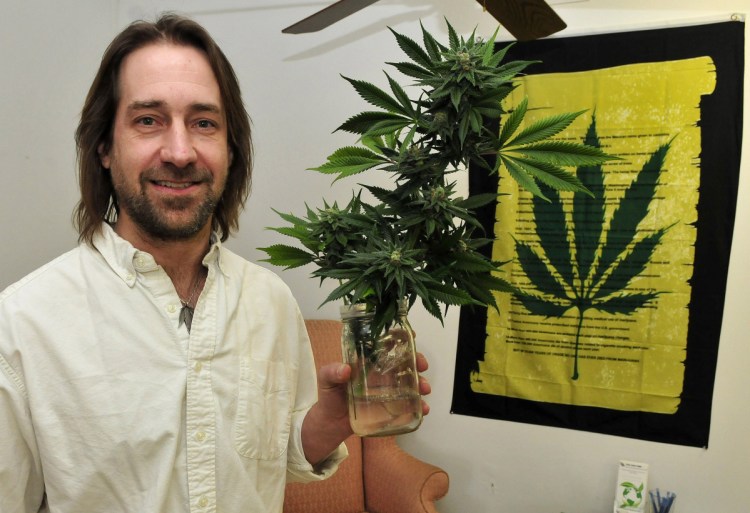 Medical marijuana caregiver Dawson Julia serves hundreds of patients at his shop in Unity. He is concerned that one provision of the bill might let towns force caregivers out of business. 