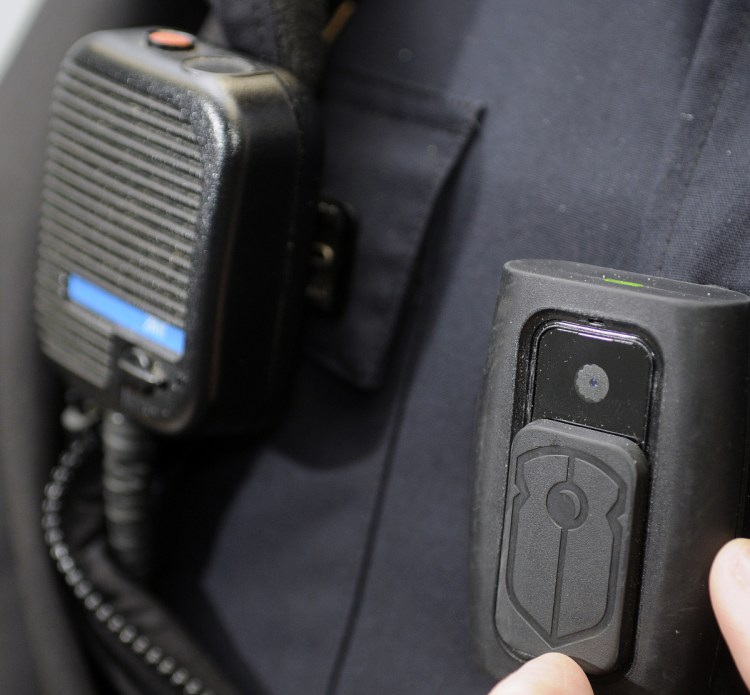 A body camera, right, is attached to the chest of a Gardiner police officer. 
