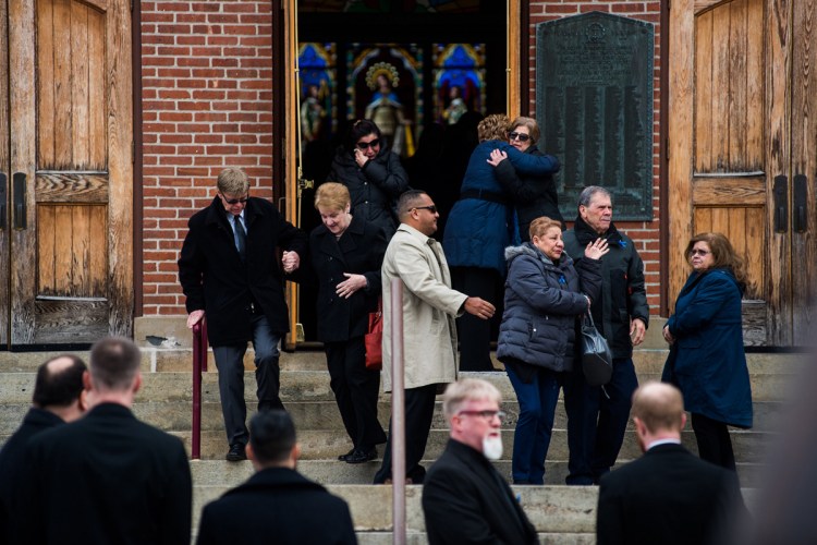 Family and friends grieve outside St. Mary's Church after the funeral service for Marissa Kennedy in the City of Newburgh, N.Y., on Saturday. Marissa Kennedy, formerly of New Windsor was beaten allegedly to death by her mother and stepfather in Stockton Springs, Maine. Times Herald-Record/Kelly Marsh