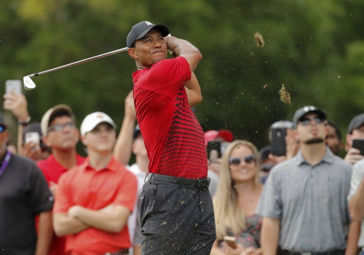 Tiger Woods tees off on the 15th hole during the final round of the Valspar Championship Sunday in Palm Harbor, Fla. Woods finished one shot behind winner Paul Casey.