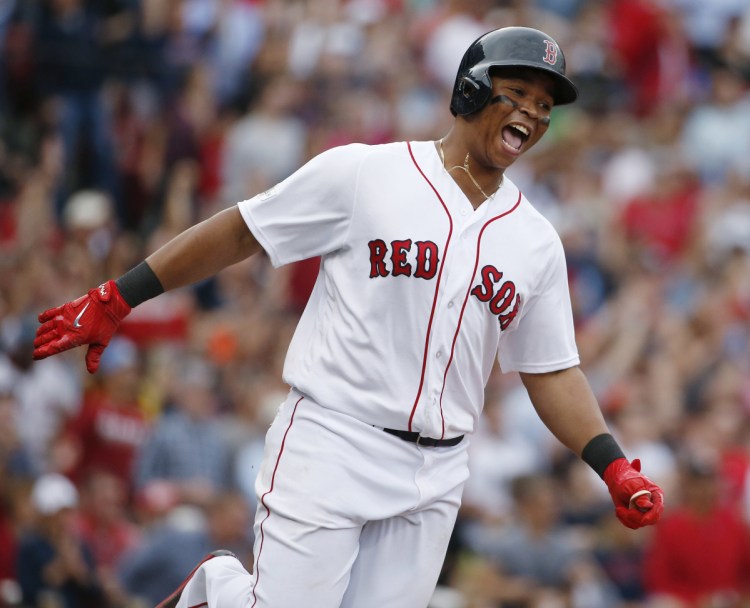 Boston's Rafael Devers celebrates his two-run homer against Houston in Game 3 of last season's AL Division Series. Devers' swing-at-everything approach often pays dividends.