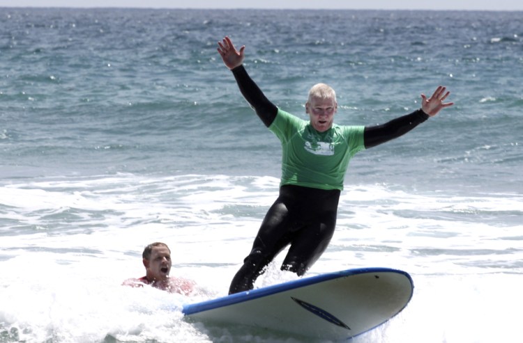 A marine surfs at Marine Corps Base Camp Pendleton in California.  The Navy has now started a $1 million research project on surfing's therapeutic benefits.