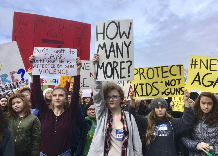 Students at Roosevelt High School take part in a protest against gun violence Wednesday in Seattle. It was part of a nationwide school walkout that calls for stricter gun laws following the massacre of 17 people at a Florida high school.