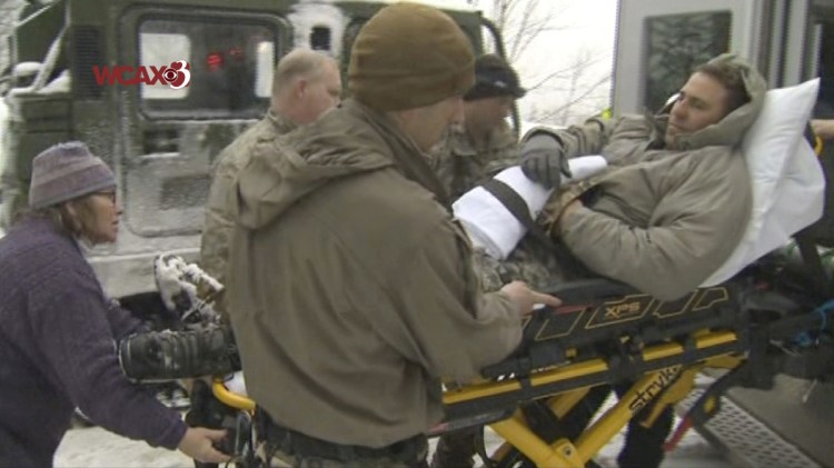 In this still image from video provided by WCAX-TV Channel 3, a U.S. Army soldier is evacuated on a stretcher following an avalanche Wednesday while he was participating in U.S. Army mountain-wartime training near Easy Gully in Smugglers' Notch, a narrow pass at the edge of Mount Mansfield, in Cambridge, Vermont. Six U.S. soldiers were injured in the avalanche.