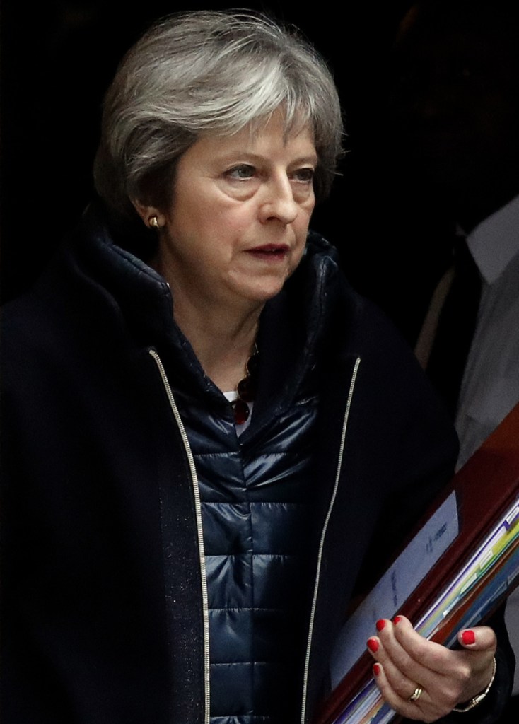 Britain's Prime Minister Theresa May leaves 10 Downing Street to attend the weekly Prime Minister's Questions session, in parliament Wednesday.