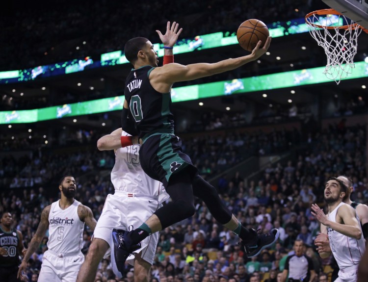 Boston forward Jayson Tatum drives to the basket against the Wizards during the first quarter Wednesday night in Boston.