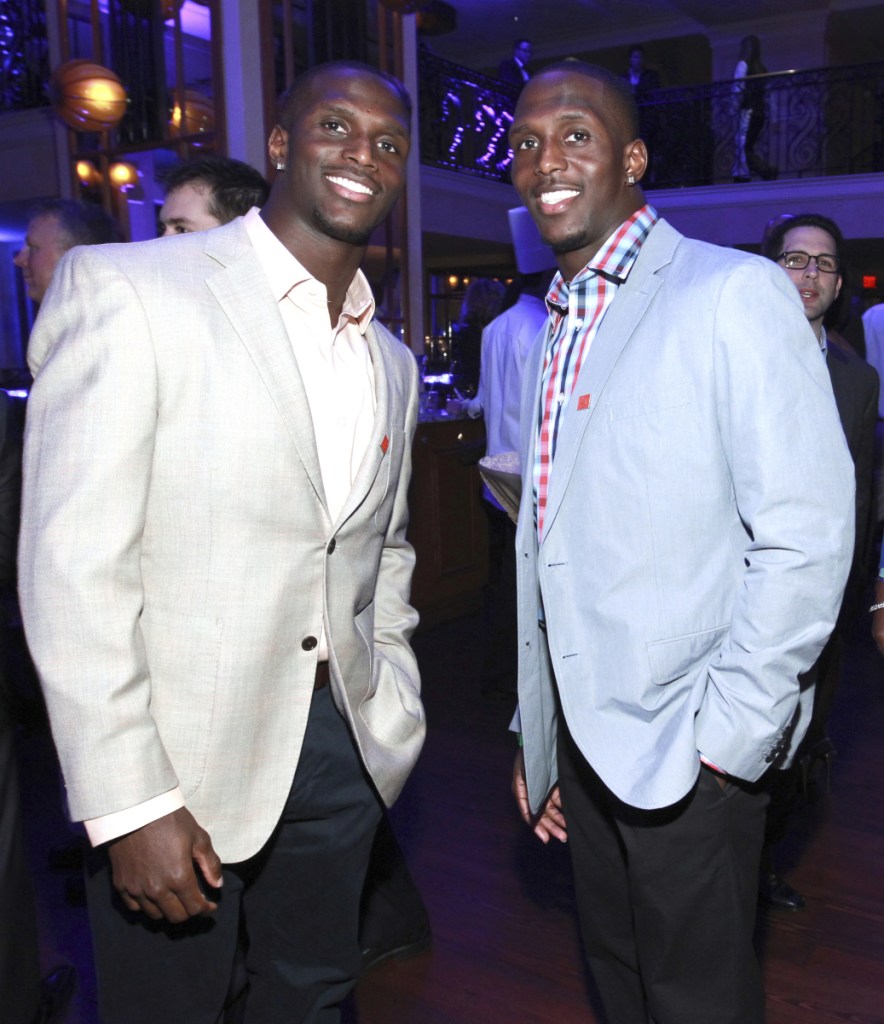 In this Jan. 31, 2013 photo, Jason McCourty, left, Devin McCourty pose at the VIP Reception hosted by the NFLPA in New Orleans.