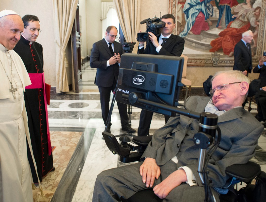 Pope Francis greets physicist Stephen Hawking during an audience with participants at a plenary session of the Pontifical Academy of Sciences at the Vatican in 2016. Hawking, whose brilliant mind ranged across time and space, died Wednesday.