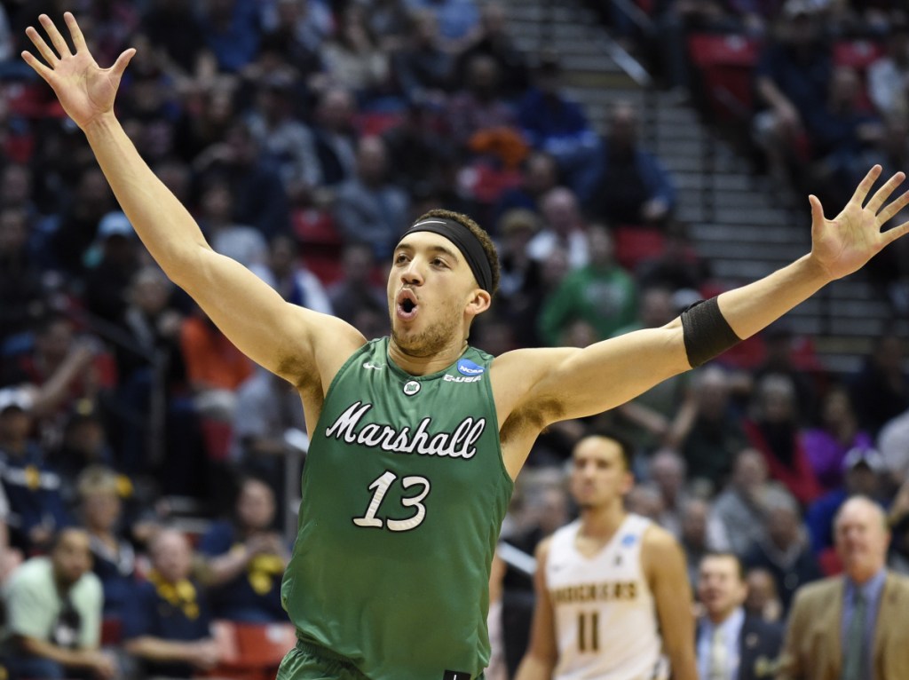 Jarrod West of Marshall reacts Friday as time runs out and the 13th-seeded Thundering Herd advance to the Round of 32, winning an NCAA tournament game for the first time by shocking fourth-seeded Wichita State 81-75 in the East Regional at San Diego.