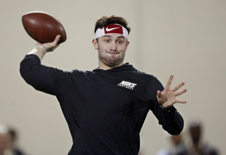 Oklahoma quarterback Baker Mayfield passes during a drill at his pro day workout in Norman, Okla. Mayfield, Wyoming's Josh Allen, USC's Sam Darnold and UCLA's Josh Rosen could all go early in the first round of the NFL draft.