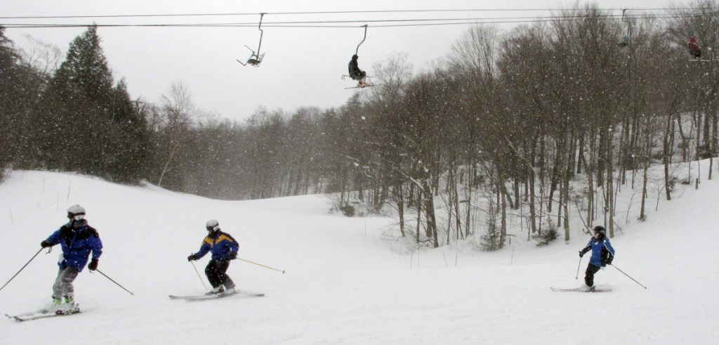 Skiers maneuver down a slope Thursday at Mad River Glen in Fayston, Vt. Five feet of snow has fallen in Vermont this month and many areas of Maine have received more than 2 feet, "It's the best March in years," said skier Gregg Fitzgerald.