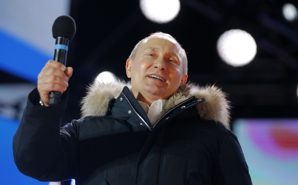 Russian President Vladimir Putin during a rally outside the Kremlin in Moscow, Sunday. He thanked the crowd for their support in the "very difficult circumstances" of recent years.