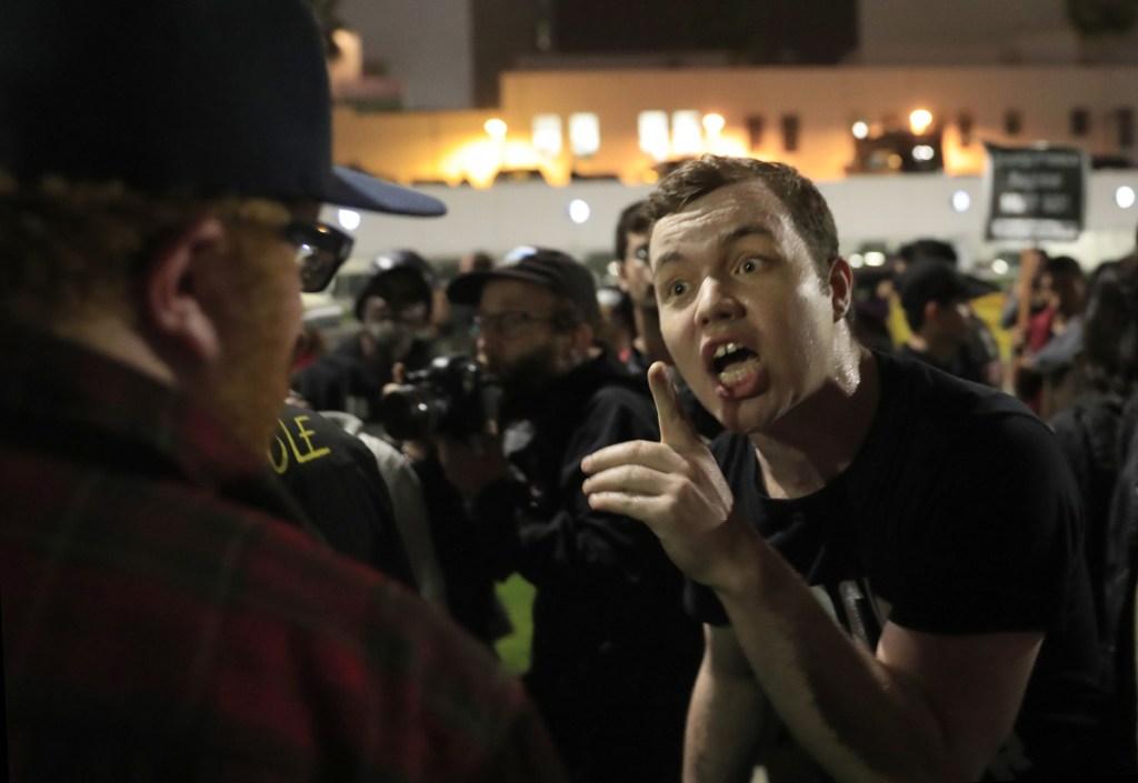 Ian Jameson, of Pasadenans and Altadenans Against Police Violence, shouts at a President Trump supporter during a protest in Beverly Hills, Calif., on March 13.