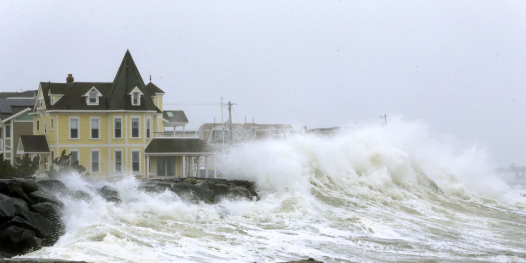 Heavy ocean surf crashes over the seawall between 7th and 8th streets in Avalon, N.J., on Wednesday. An early spring coastal storm brought wintry conditions to the southern part of the state, with high winds, coastal flooding, rain, sleet and snow.