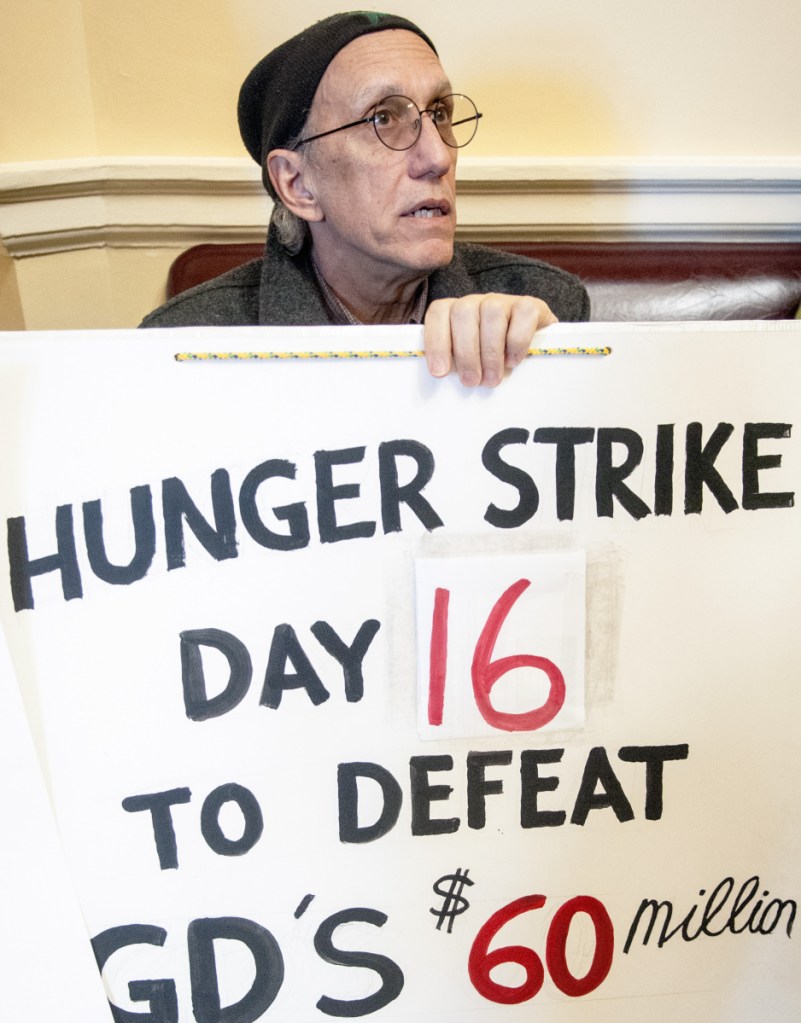 Bruce Gagnon of Bath, who opposes a multimillion-dollar tax break for Bath Iron Works, protests Feb. 27 at the State House. He ended his hunger strike Tuesday after 37 days.
