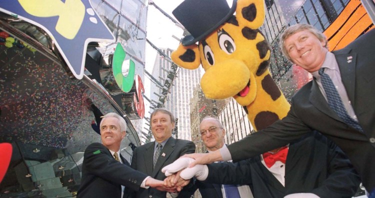 Toys R Us founder Charles Lazarus is shown second from right at the 2001 grand opening of the Toys R Us store in New York's Times Square. Also pictured, from left, are Elliott Wahle, vice president and general manager of the new store; John Eyler, chairman, president and CEO; and Gregory Staley, president, U.S. toy stores.