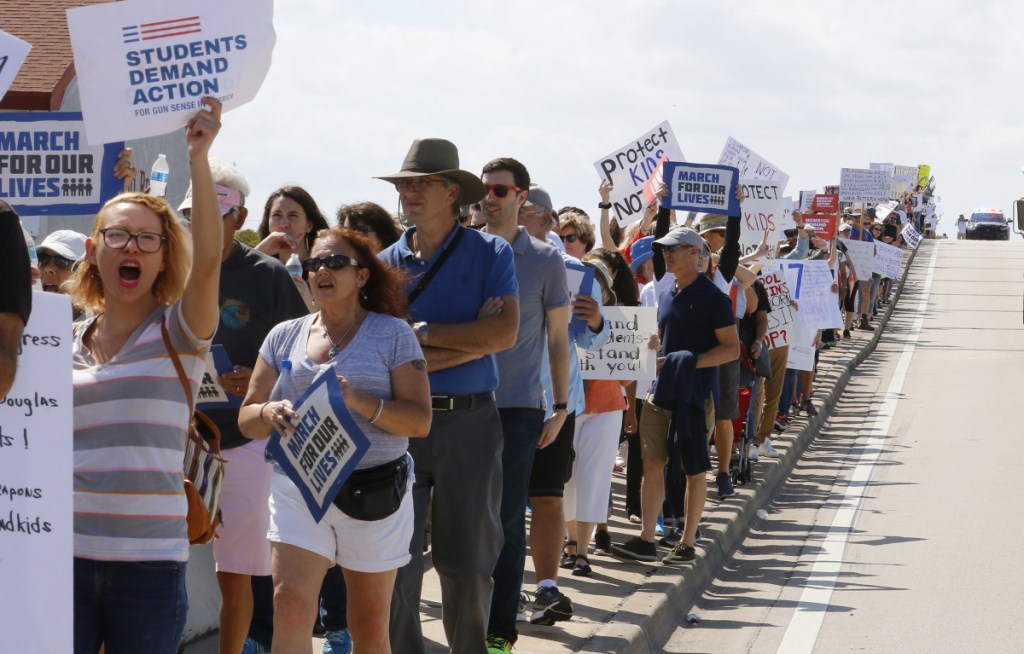 Protesters take part in the March for Our Lives on Saturday in West Palm Beach, Fla. After the rampage at Marjory Stoneman Douglas High, President Trump explored the possibility of arming teachers. But educators say the conversation needs to go beyond mass shootings and include the violence that the most vulnerable children face daily in their communities.