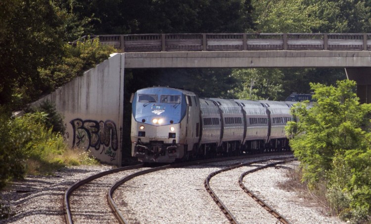 The northbound Amtrak Downeaster heads toward Brunswick in March.