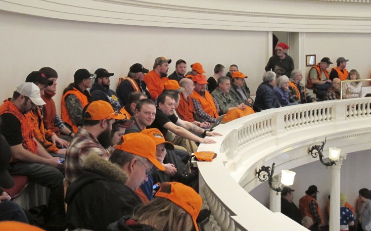 Gun control opponents wearing hunter orange pack the gallery in the Vermont House of Representatives on March 27 in Montpelier, Vt.
